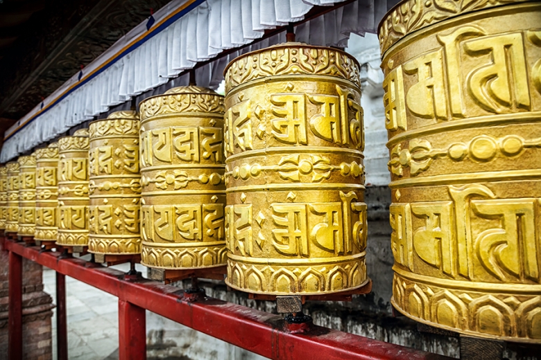 Golden prayer wheels at Swayambhunath stupa in Kathmandu, Nepal