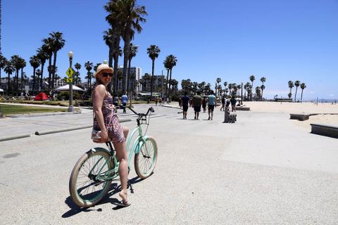 Anna cycling along Venice Beach in Los Angeles