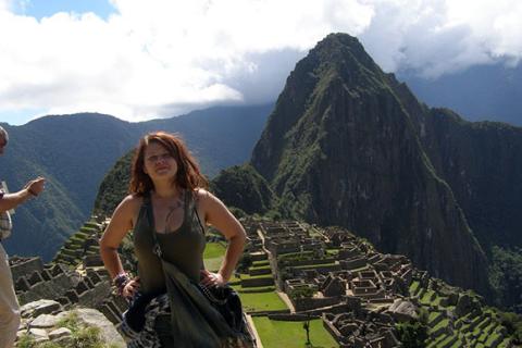 Alex proudly standing at Machu Picchu, Peru