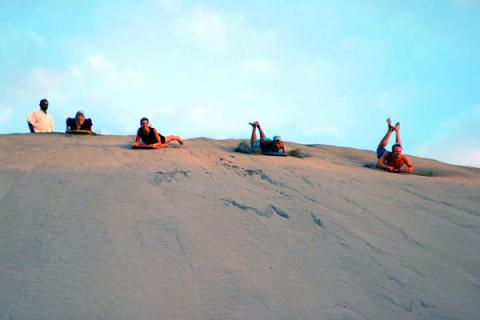 Have a go at sandboarding in Fiji